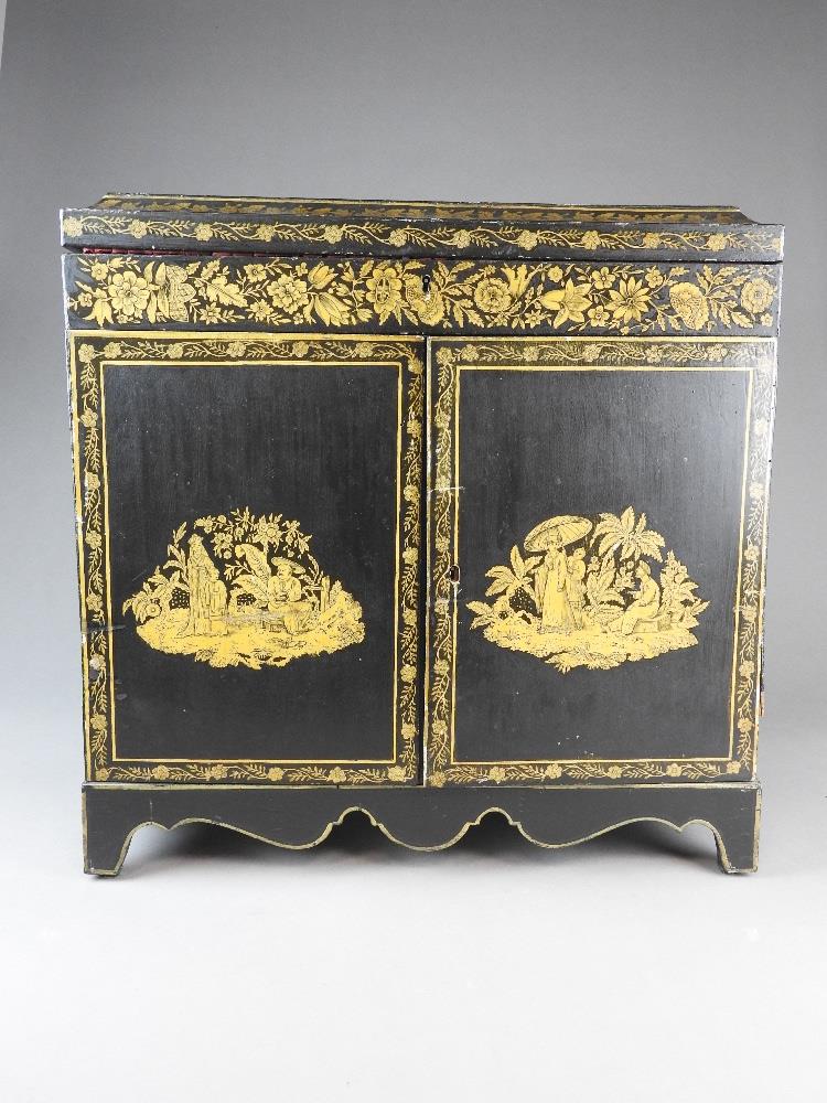 A chinoiserie lacquered collectors' cabinet,