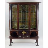 An Arts and Crafts mahogany display cabinet, circa 1910,