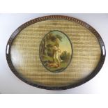 A George III Pontypool type tole peinte oval two handled tray painted with classical scene after