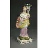 A Staffordshire pearlware candlestick figure, perhaps of Diana, circa 1800-20,