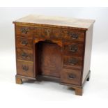 A mahogany and walnut veneered knee-hole dressing table of George III design,