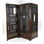 A Middle Eastern hardwood two fold, three panel screen, 19th century,