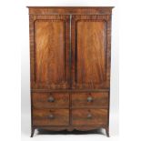 A late Regency mahogany and ebony strung linen press,