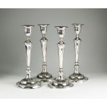 A set of four Garrards silver mounted candlesticks, R & S Garrard & Co, London 1916,