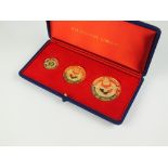 A cased 18ct gold three medallion Battle of Britain 25th Anniversary set, by metal import Ltd,