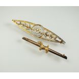 A diamond and seed pearl bar brooch, of navette form with pierced decoration,
