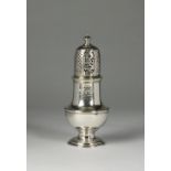 A mid 18th century silver sugar caster, marks indistinct, of baluster form with engraved crest, 14.