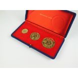A cased 18ct gold three medallion Battle of Britain 25th Anniversary set, by metal import Ltd,
