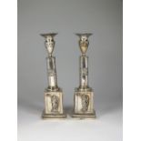 A pair of 19th century continental white metal candlesticks,