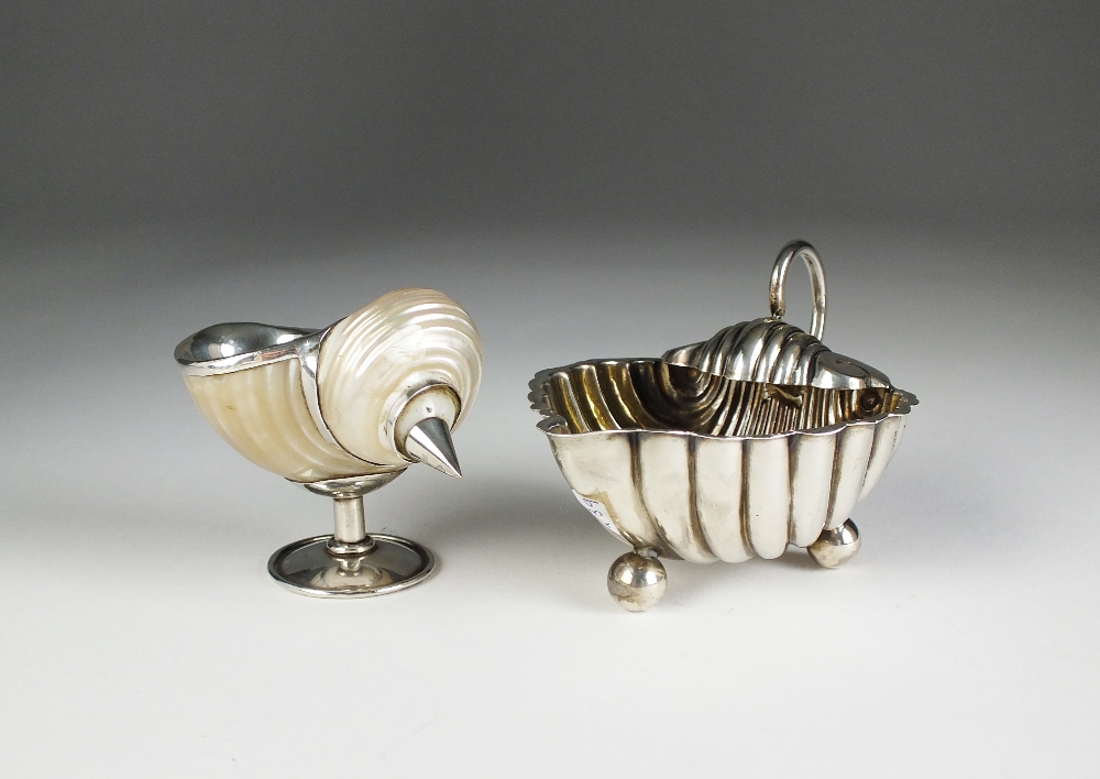 A shell moulded silver salt, Elkington & Co, Birmingham 1897, with loop handle,