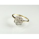 A diamond floral cluster ring,