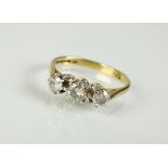 An 18ct gold three stone diamond ring,