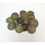 A William III half crown, together with a collection of nineteen shillings,