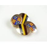 A pair of enamelled cufflinks,