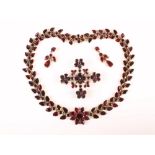 An early 19th century garnet parure, comprising; a necklace,