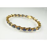 A sapphire and diamond line bracelet,