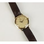 A Gentleman's 9ct gold Omega Automatic wristwatch, the silvered dial with batons,