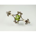 A late 19th/early 20th century peridot, diamond and seed pearl bar brooch,