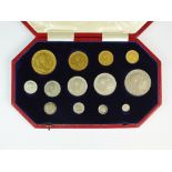 An Edward VII cased specimen thirteen coin set, dated 1902, to include; £5, £2, sovereign,