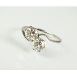 A two stone diamond crossover ring,