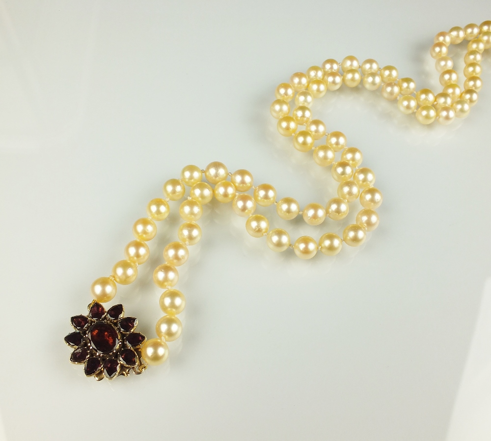 A uniform cultured pearl opera necklace,