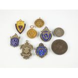 Three 9ct gold Shropshire Football medals,