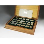 The Stamps of Royalty, a cased collection of twenty-five sterling silver replica stamps,
