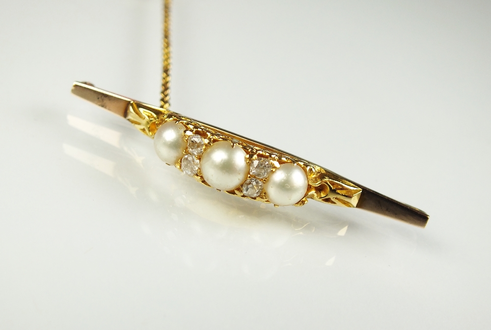 A pearl and diamond bar brooch,