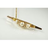 A pearl and diamond bar brooch,