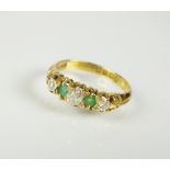 An 18ct gold five stone emerald and diamond ring,