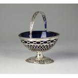 A silver pedestal basket, import marks for London 1903,