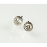 A pair of 18ct white gold diamond stud earrings,