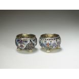 A near pair of Russian cloisonne enamel silver salts, each of cauldron form with blue, red, white,