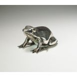 An Edwardian novelty silver pin cushion in the form of a frog,