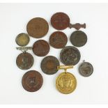 A collection of twelve assorted white metal and bronze award medals, to include; 'Poultry Club',