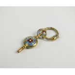 An early 19th century blue and red enamelled watch key, with enamelled stylised snake split ring,