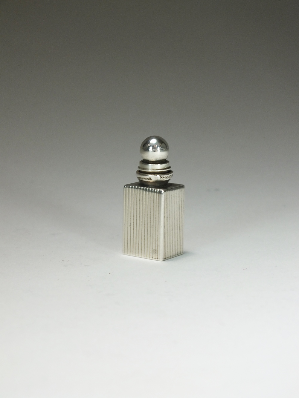 A Tiffany & Co silver miniature scent bottle, of rectangular reeded form,