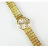 A Lady's 18ct gold Omega bracelet watch, the silvered dial with Arabic numerals, manual wind,