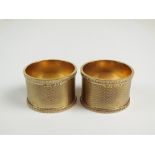 A pair of 9ct gold napkin rings, H F Withers, Birmingham 1987,