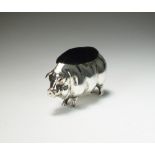 An early 20th century novelty silver mounted pin cushion in the form of a pig, Levi & Salaman,