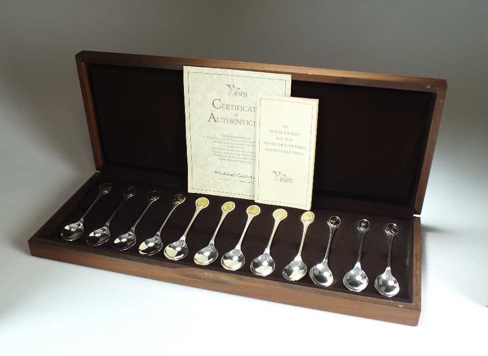 A cased set of twelve commemorative silver and gilt spoons, John Pinches, London 1976,