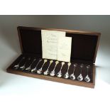 A cased set of twelve commemorative silver and gilt spoons, John Pinches, London 1976,