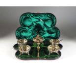 A cased Victorian silver gilt condiment set