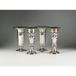 Two pairs of silver vases