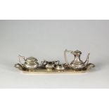 A silver miniature tea service