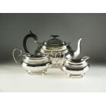 A three piece silver tea service