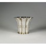 A white metal vase