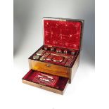 An early 19th century cased silver gilt dressing table set