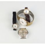 A collection of four wristwatches