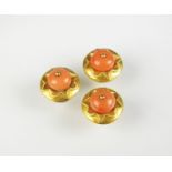 Three coral dress studs